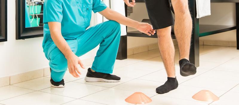 A person doing a balance test with a doctor.