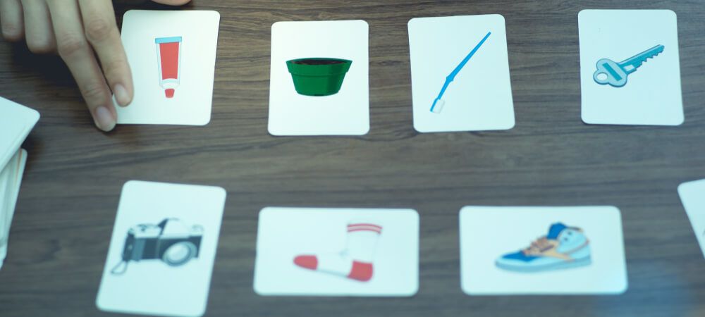 Therapy for dementia patients: A memory game being played with picture cards.