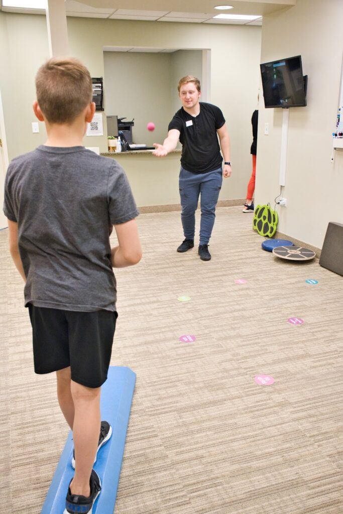 A patient doing an exercise at Neural Effects.