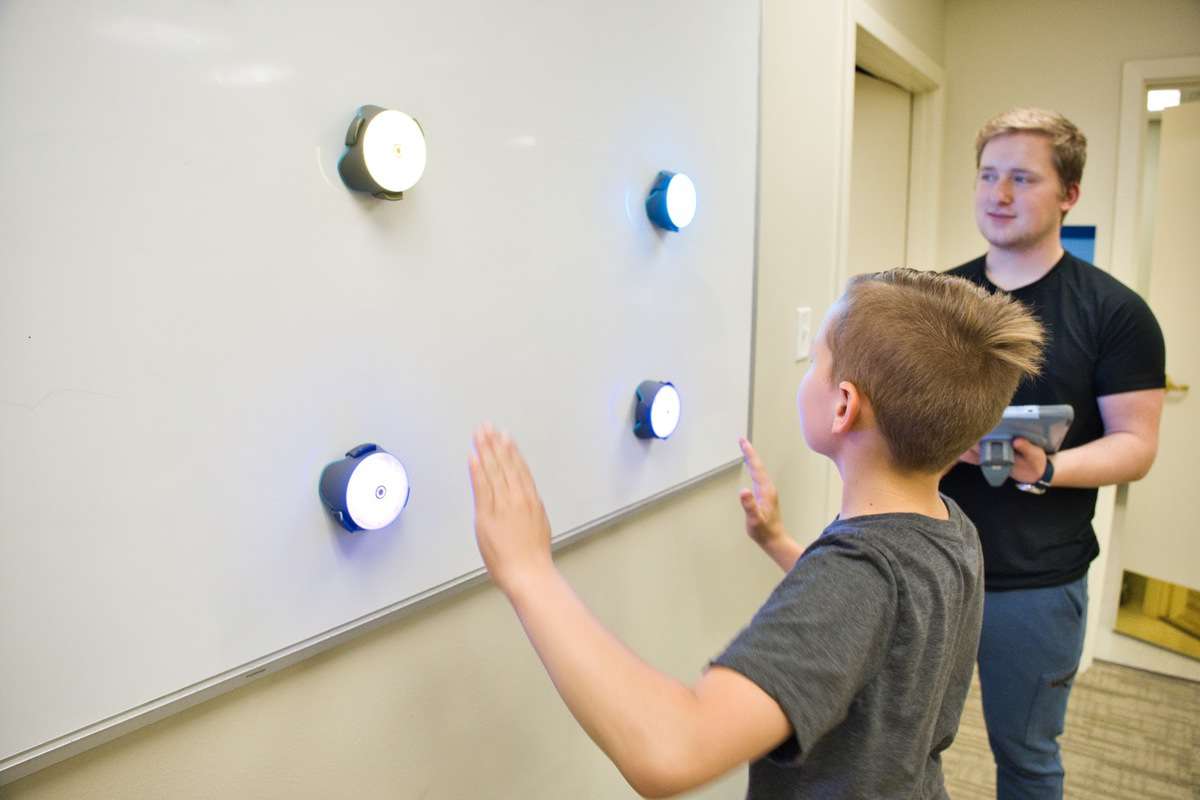 A young boy going through treatment at Neural Effects.