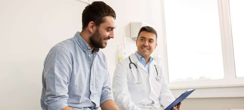 Doctor sitting with patient. 