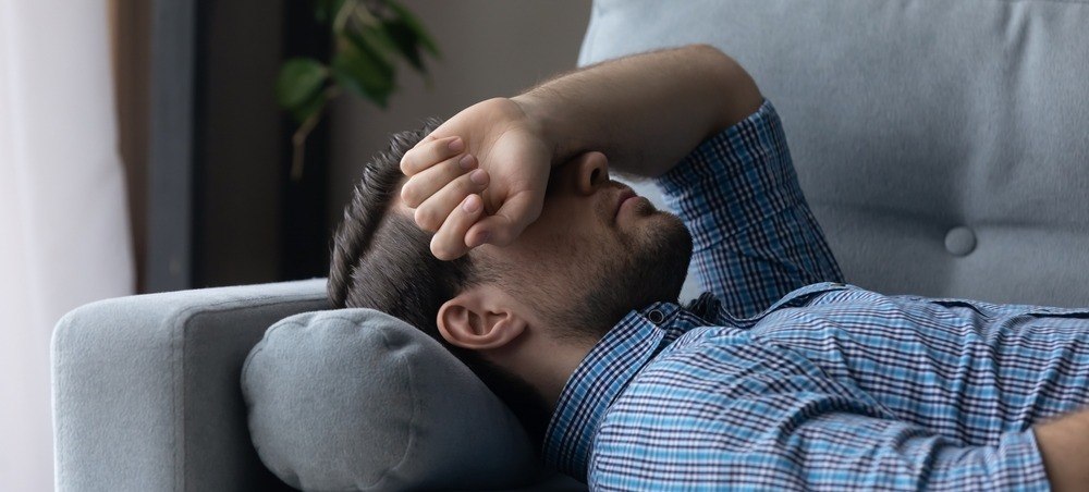 Man resting because of a headache. 