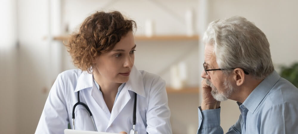 A doctor meets with their patient