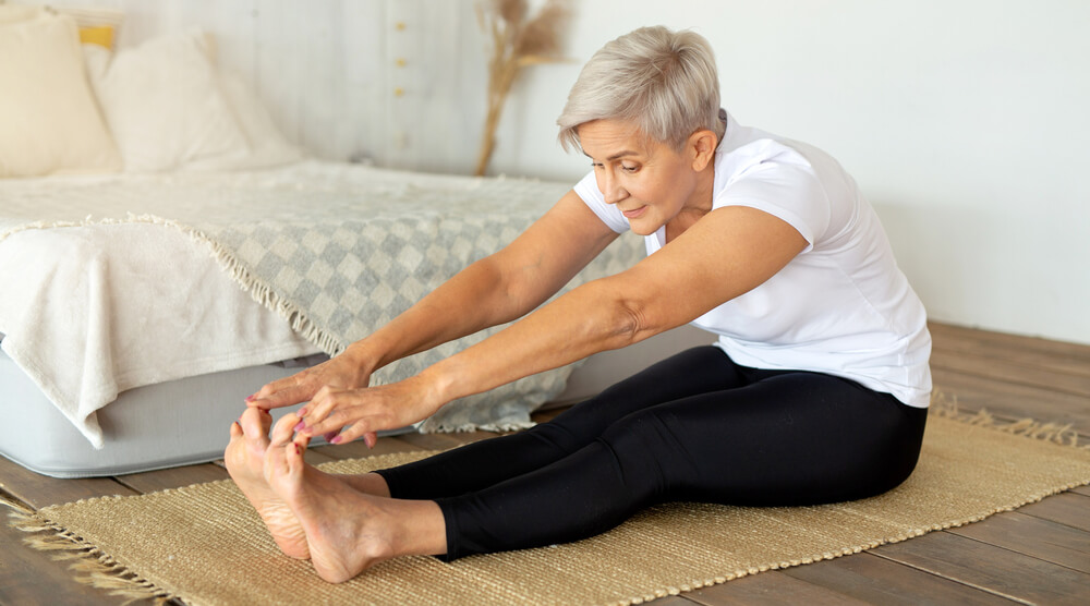 A woman doing yoga at home