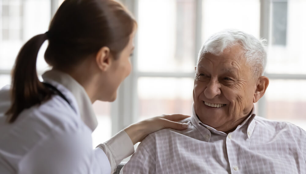 A doctor is talking to her patient who has dementia