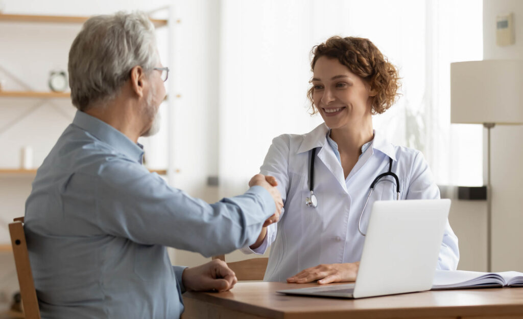 Doctor shaking hands with patient