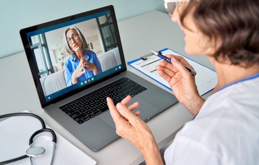 A woman has a virtual consultation with her doctor