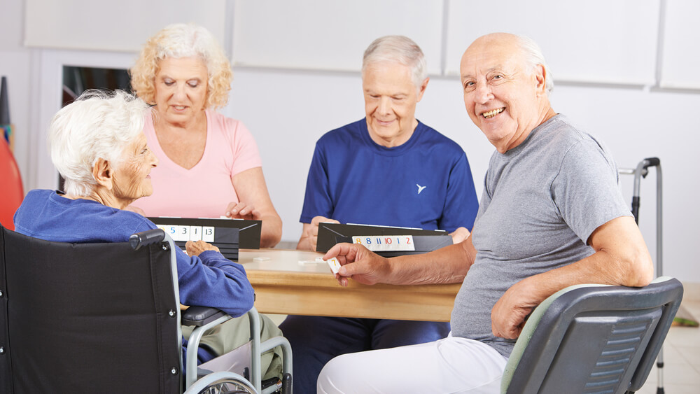 Group of seniors playing Rummikub