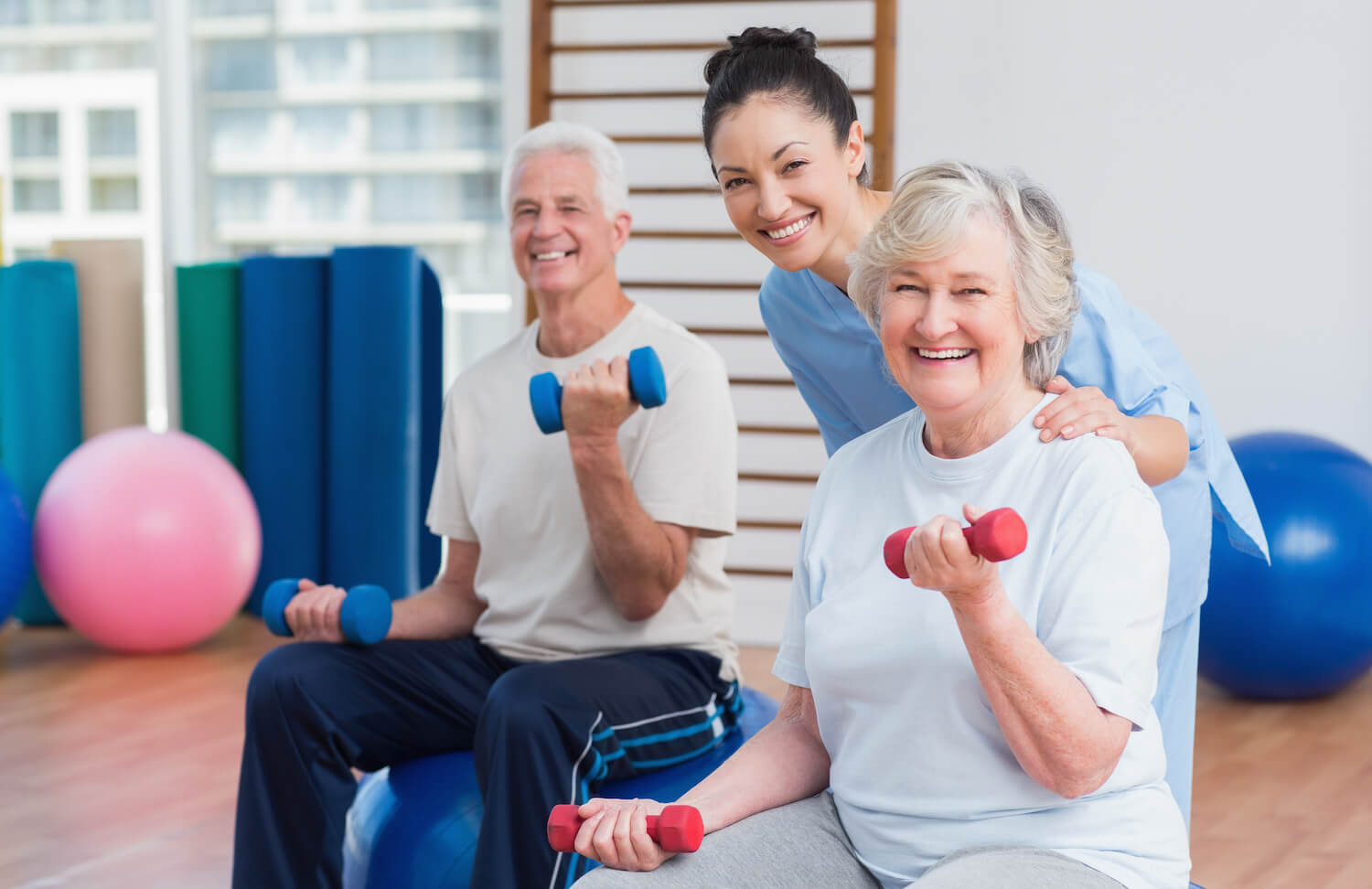 Seniors exercising with weights