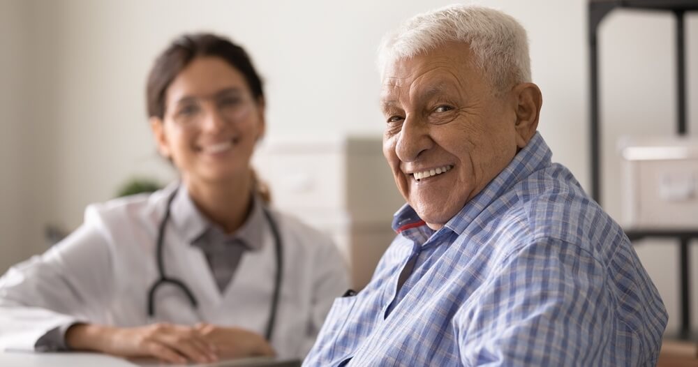 Happy senior patient meeting with doctor