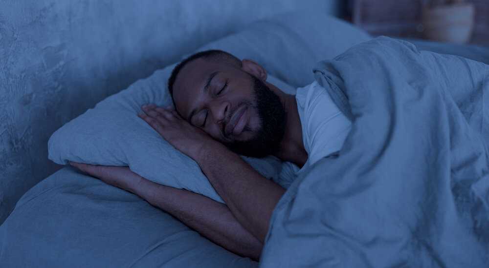 Man peacefully sleeping in bed