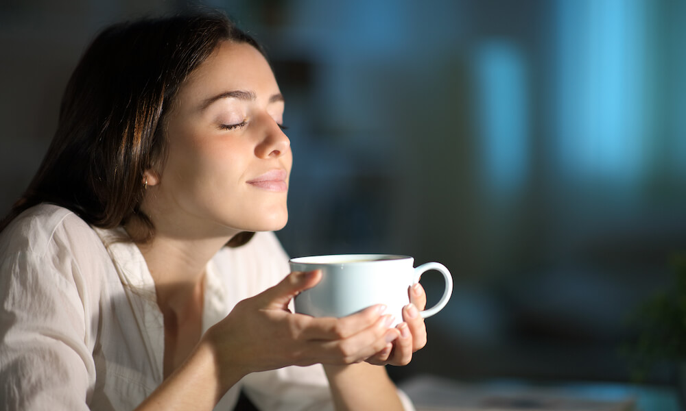 Woman relaxing and drinking tea