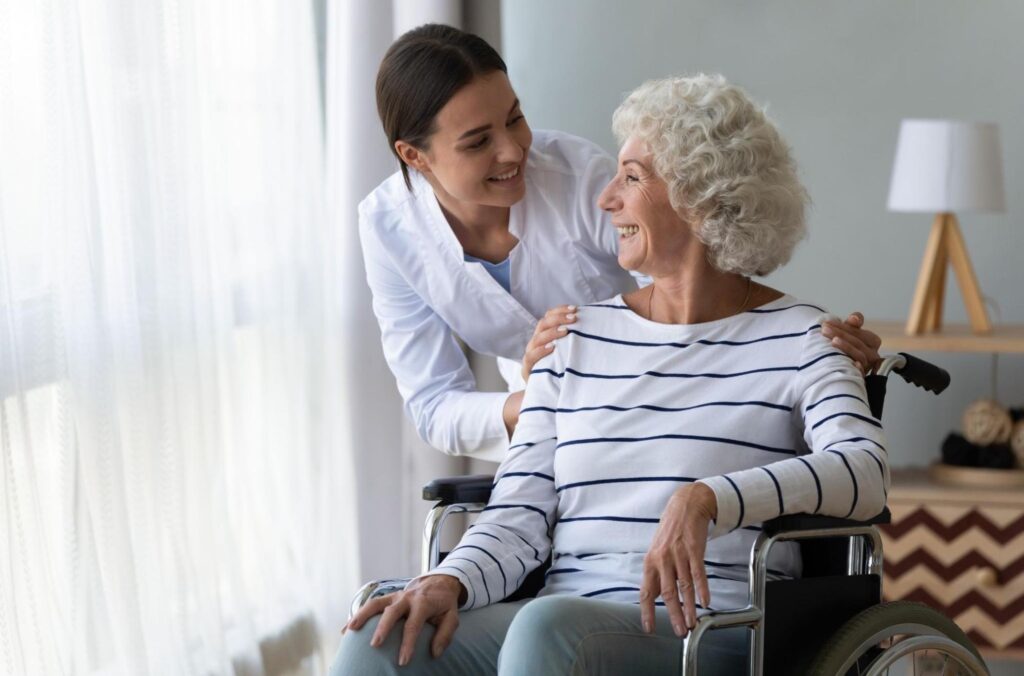 Senior woman in wheelchair with doctor
