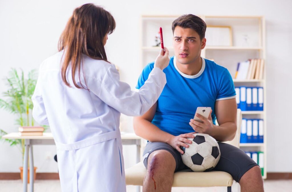 Soccer player meeting with his doctor after an injury while playing